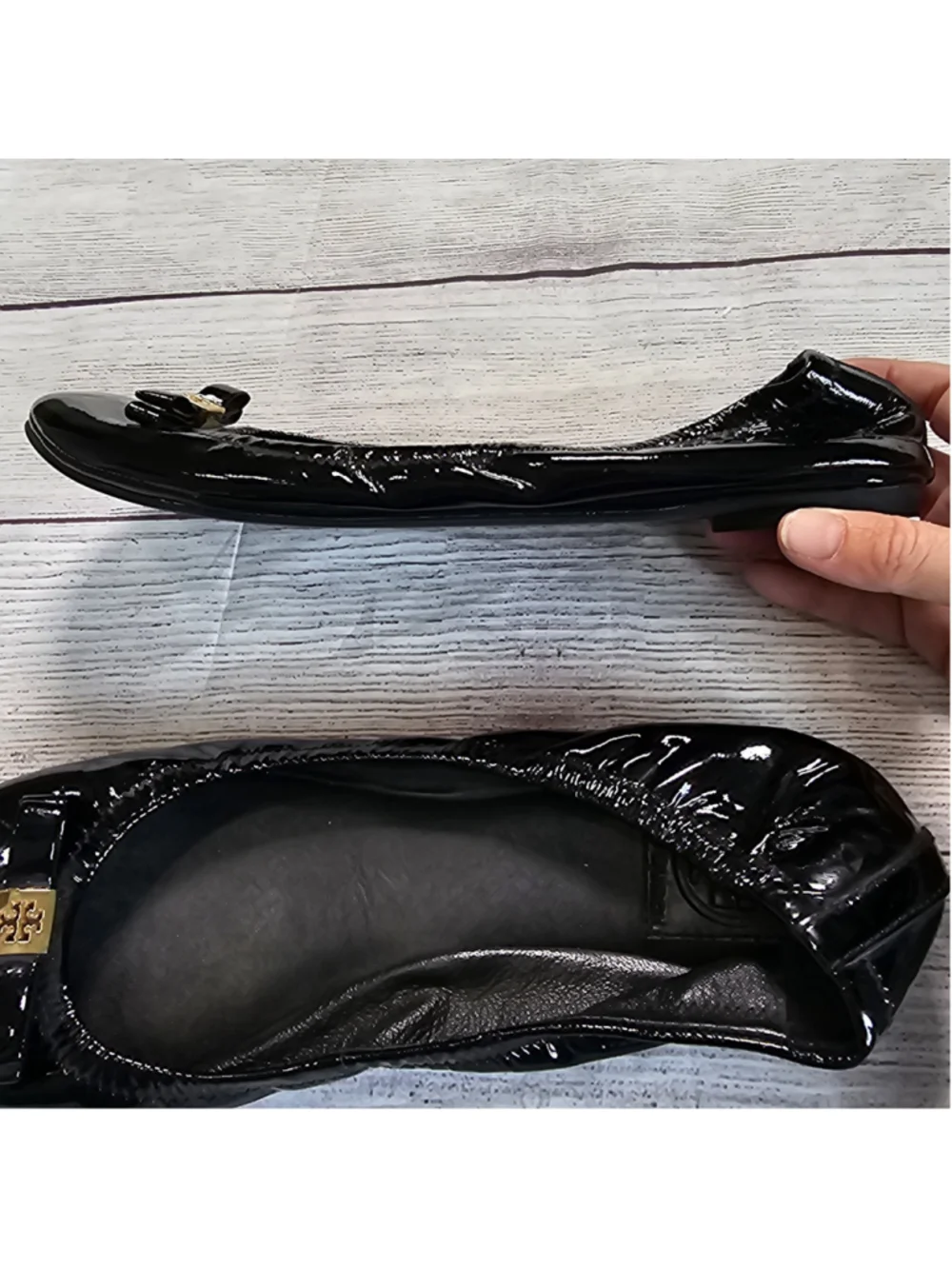 Tory Burch 10M shiny black ballerina flats with black and gold bow accent